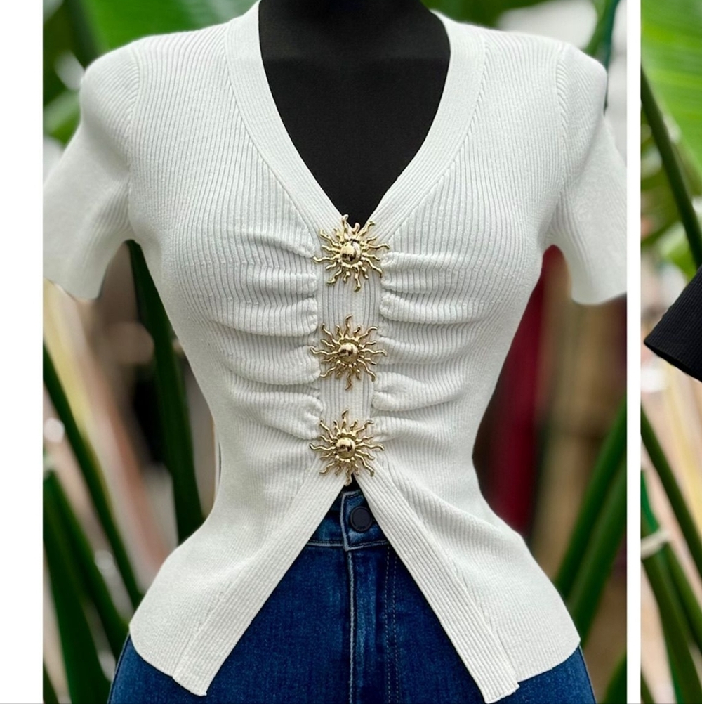 Elegant White Ribbed Blouse with Gold Sunburst Details